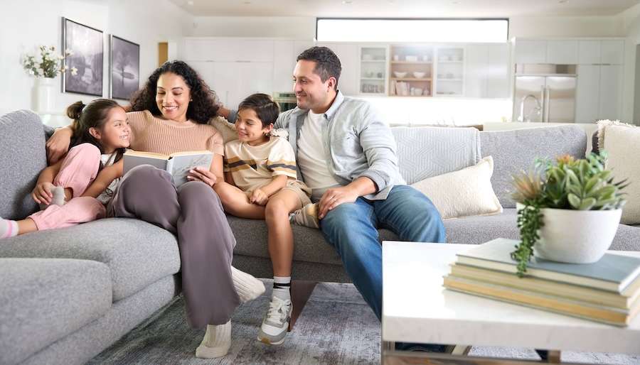 Family relaxing on the sofa in a living room with clean indoor air