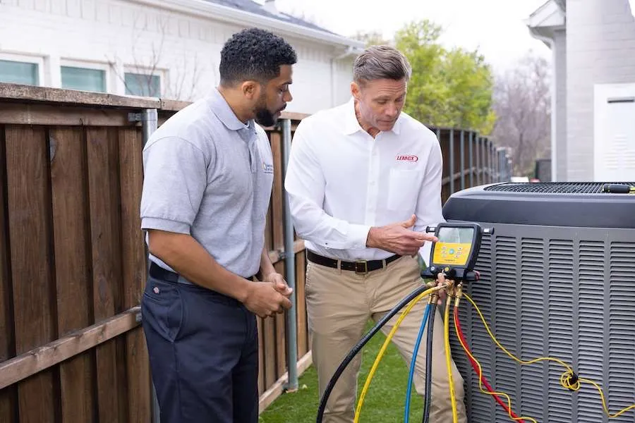 Purified Air technicians servicing an outdoor AC unit